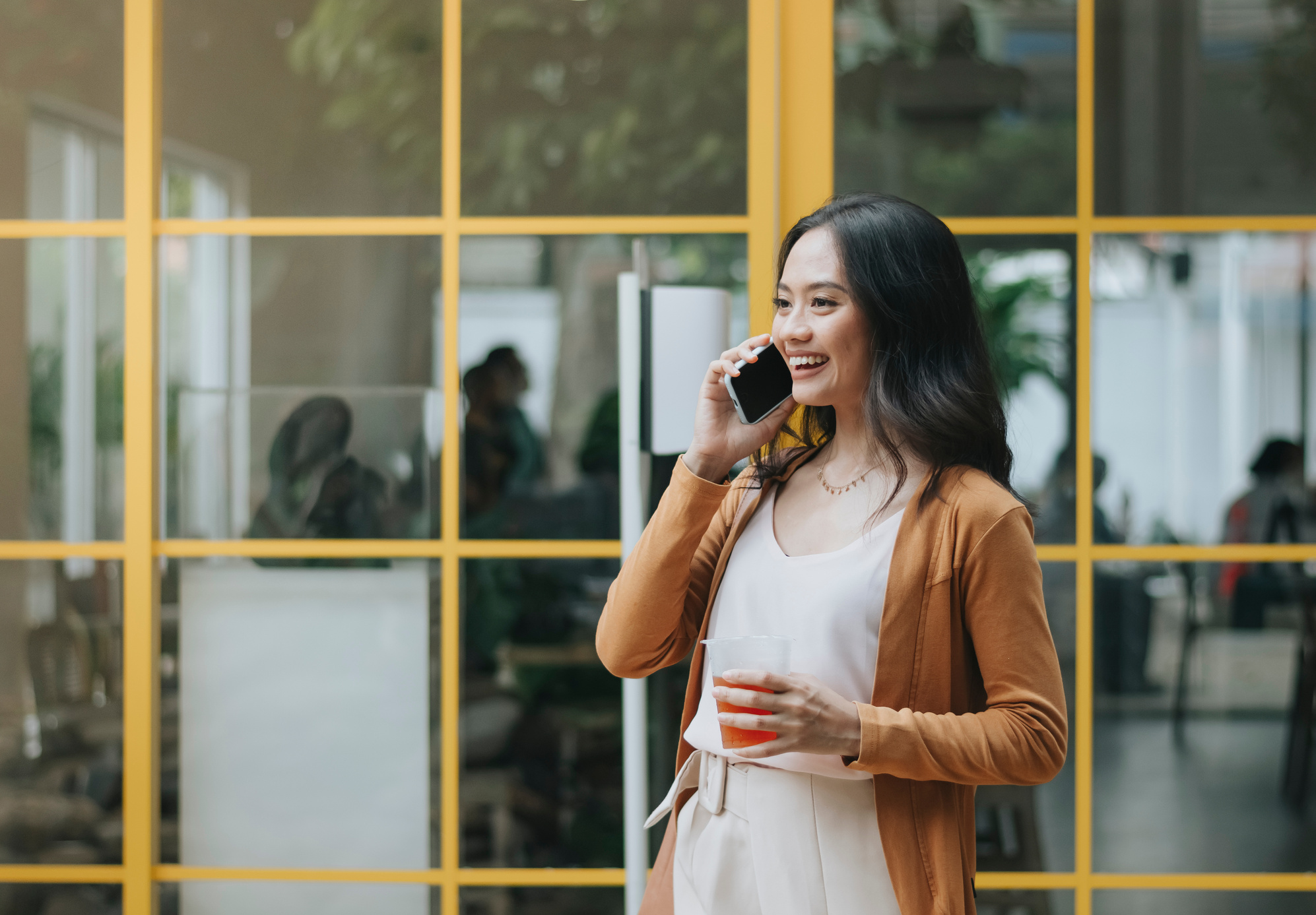 Woman Talking on the Phone Outside the Office